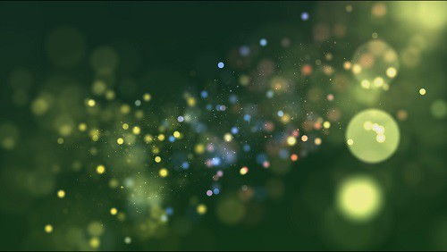 Dtream of particles on a green background